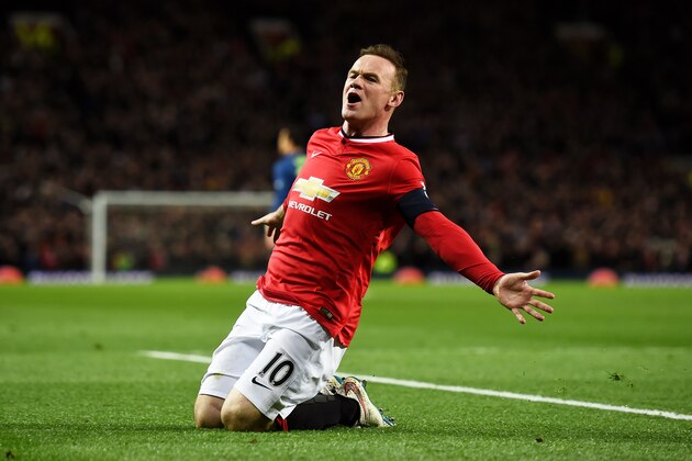 MANCHESTER, ENGLAND - MARCH 09:  Wayne Rooney of Manchester United celebrates after scoring a goal to level the scores at 1-1 during the FA Cup Quarter Final match between Manchester United and Arsenal at Old Trafford on March 9, 2015 in Manchester, England.  (Photo by Laurence Griffiths/Getty Images)