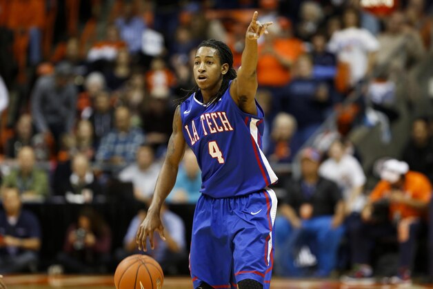 Jan 8, 2015; El Paso, TX, USA; Louisiana Tech Bulldogs guard Kenneth Smith (4) calls a play as his team faces the UTEP Miners at the Don Haskins Center. The Bulldogs defeated the Miners 58-45. Mandatory Credit: Ivan Pierre Aguirre-USA TODAY Sports