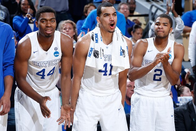 LOUISVILLE, KY - MARCH 21:  Teammates Dakari Johnson #44, Trey Lyles #41 and Aaron Harrison #2 of the Kentucky Wildcats cheer on from the bench against the Cincinnati Bearcats during the third round of the 2015 NCAA Men's Basketball Tournament at KFC YUM! Center on March 21, 2015 in Louisville, Kentucky.  (Photo by Joe Robbins/Getty Images)