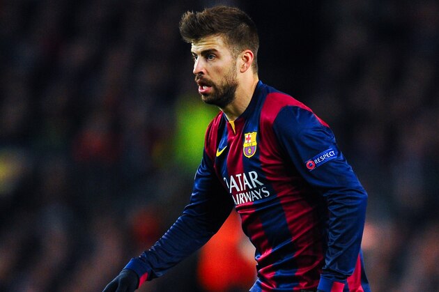 BARCELONA, SPAIN - MARCH 18:  Gerard Pique of FC Barcelona runs with the ball during the UEFA Champions League round of 16 second leg match between FC Barcelona and Manchester City at the Camp Nou stadium on March 18, 2015 in Barcelona, Spain.  (Photo by David Ramos/Getty Images)