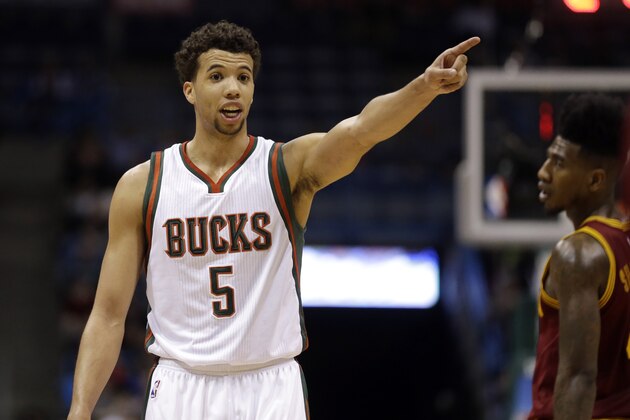 Milwaukee Bucks' Michael Carter-Williams points during an NBA basketball game against the Cleveland Cavaliers Sunday, March 22, 2015, in Milwaukee. (AP Photo/Aaron Gash)
