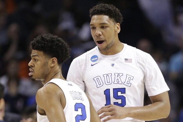 Duke's Jahlil Okafor (15) and Quinn Cook (2) celebrates during the first half of an NCAA tournament college basketball game against San Diego State in the Round of 32 in Charlotte, N.C., Sunday, March 22, 2015. (AP Photo/Nell Redmond) Duke's Jahlil Okafor (15) and Quinn Cook (2) celebrates during the first half of an NCAA tournament college basketball game against San Diego State in the Round of 32 in Charlotte, N.C., Sunday, March 22, 2015. (AP Photo/Nell Redmond)