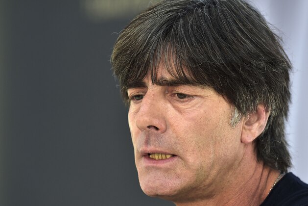 Germany's head coach Joachim Loew talks listens to the media at a press conference in Essen, Germany, Monday, Oct. 13, 2014. Germany will play a Euro 2016 group D qualifying soccer match against Ireland on Tuesday in Gelsenkirchen. (AP Photo/Martin Meissner)