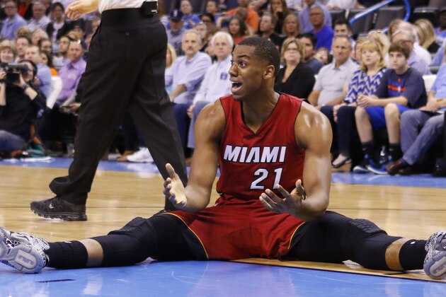 Miami Heat center Hassan Whiteside (21) reacts to an officials call during the first half of an NBA basketball game against Miami Heat in Oklahoma City, Sunday, March 22, 2015. (AP Photo/Alonzo Adams)