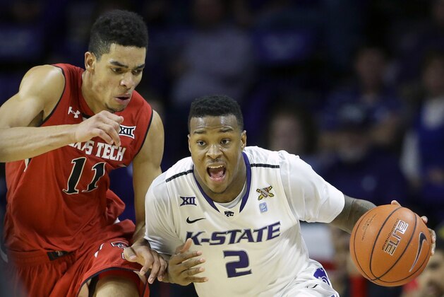 Kansas State's Marcus Foster (2) is pressured by Texas Tech's Zach Smith (11) as he drives with the ball during the second half of an NCAA college basketball game Wednesday, Jan. 14, 2015, in Manhattan, Kan. Kansas State won 58-51. (AP Photo/Charlie Riedel)