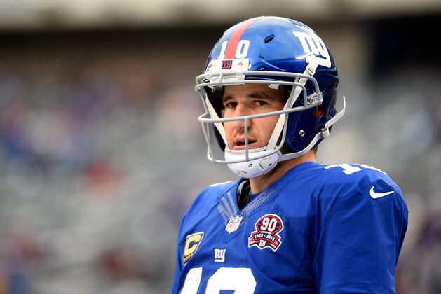 EAST RUTHERFORD, NJ - DECEMBER 14:  Eli Manning #10 of the New York Giants looks on during warm-ups prior to their game against the Washington Redskins at MetLife Stadium on December 14, 2014 in East Rutherford, New Jersey.  (Photo by Alex Goodlett/Getty Images)