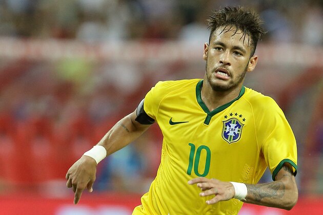 SINGAPORE - OCTOBER 14:  Neymar of Brazil in action during the international friendly match between Japan and Brazil at the National Stadium on October 14, 2014 in Singapore.  (Photo by Suhaimi Abdullah/Getty Images)
