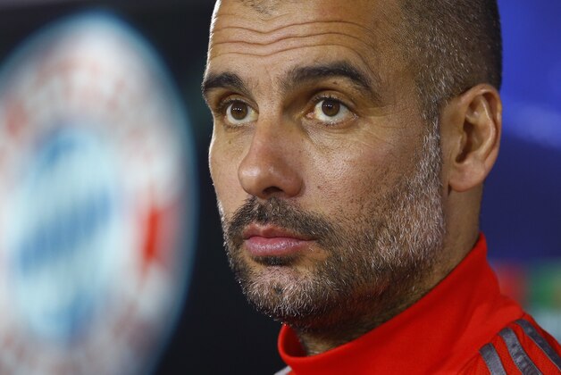 Bayern's head coach Pep Guardiola of Spain attends a news conference prior to the Champions League round of 16 second leg soccer match between Bayern Munich and Shakhtar Donetsk in Munich, southern Germany, Tuesday, March 10, 2015. Bayern will face Shakhtar on Wednesday. (AP Photo/Matthias Schrader)
