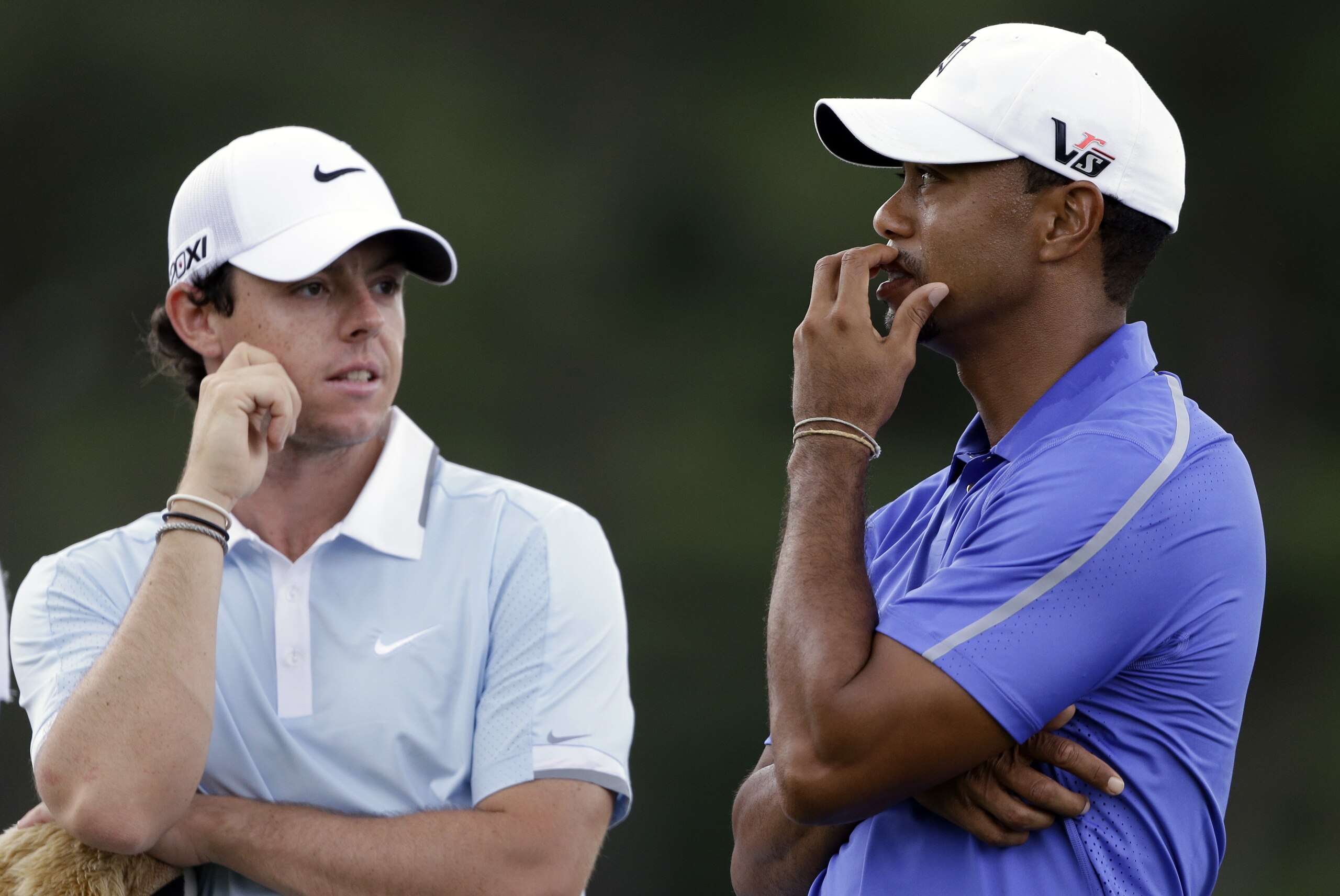 Tiger Woods, right, talks with Rory McIlroy, of Northern Ireland, on the second hole during the first round of the U.S. Open golf tournament at Merion Golf Club, Thursday, June 13, 2013, in Ardmore, Pa. (AP Photo/Darron Cummings)