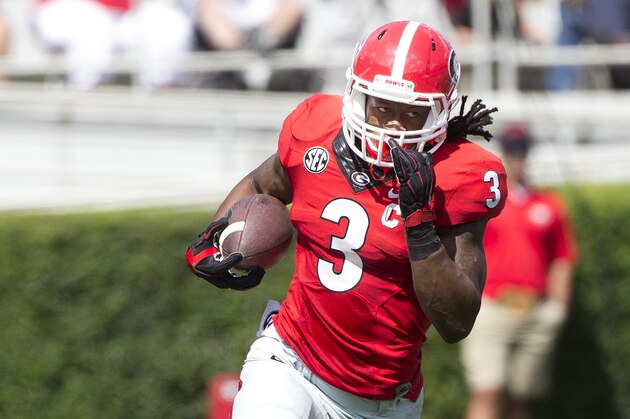 Georgia running back Todd Gurley (3) rushes for a first down in the first half of an NCAA college football game against Troy Saturday, Sept. 20, 2014, in Athens, Ga. (AP Photo/John Bazemore)