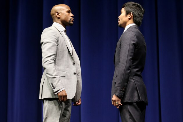 LOS ANGELES, CA - MARCH 11:  Floyd Mayweather (L) and Manny Pacquiao face off at the start of their Press Conference promoting their upcoming fight on March 11, 2015 in Los Angeles, California.  (Photo by Stephen Dunn/Getty Images)