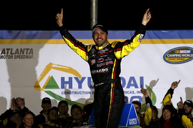 HAMPTON, GA - FEBRUARY 28:  Matt Crafton, driver of the #88 Fisher Nuts/Menards Toyota, celebrates in victory lane after winning the NASCAR Camping World Truck Series Hyundai Construction Equipment 200 on February 28, 2015 in Hampton, Georgia.  (Photo by Jeff Zelevansky/Getty Images)