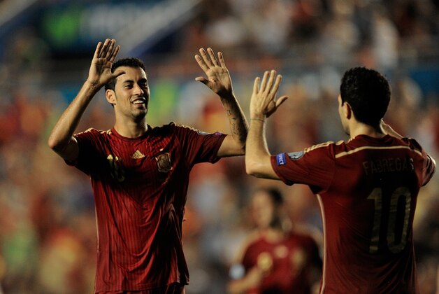 VALENCIA, SPAIN - SEPTEMBER 08:  Sergio Busquets of Spain celebrates with Cesc Fabgegas after scoring Spain's 3rd goal during the UEFA EURO 2016 Group C Qualifier between Spain and FYR  of Macedonia at Estadio Ciutat de Valencia on September 8, 2014 in Valencia, Spain.  (Photo by Denis Doyle/Getty Images)