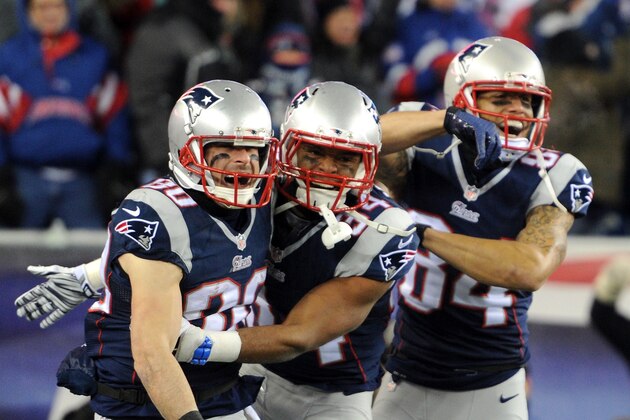 FOXBORO, MA - JANUARY 10:  Brian Tyms #84, Shane Vereen #34, and Julian Edelman #80 of the New England Patriots react after Edelman caught a touchdown pass during the second half of the 2015 AFC Divisional Playoffs game against the Baltimore Ravens at Gillette Stadium on January 10, 2015 in Foxboro, Massachusetts.  (Photo by Maddie Meyer/Getty Images)
