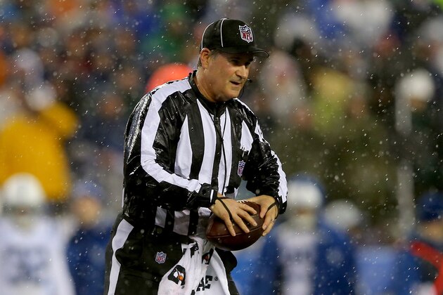 FOXBORO, MA - JANUARY 18:  Umpire Carl Paganelli #124 holds a ball on the field after a play during the 2015 AFC Championship Game between the New England Patriots and the Indianapolis Colts at Gillette Stadium on January 18, 2015 in Foxboro, Massachusetts.  It was reported on January 19, 20015 that the league is looking into the apparent use of deflated footballs by the New England Patriots during their game.  (Photo by Elsa/Getty Images)