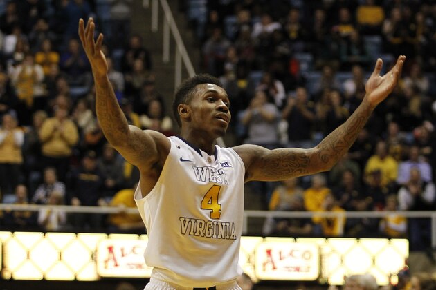 MORGANTOWN, WV - JANUARY 13:  Daxter Miles Jr. #4 of the West Virginia Mountaineers reacts to the crowd late in the second half against the Oklahoma Sooners at the WVU Coliseum on January 13, 2015 in Morgantown, West Virginia.  WVU defeated Oklahoma 86-65.  (Photo by Justin K. Aller/Getty Images)