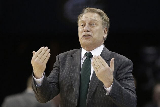 Michigan State head coach Tom Izzo directs his team against Virginia during the second half of an NCAA tournament college basketball game in the Round of 32 in Charlotte, N.C., Sunday, March 22, 2015. (AP Photo/Gerald Herbert)