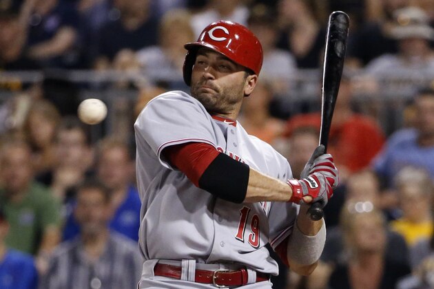 Cincinnati Reds' Joey Votto (19) gets out of the way of an inside pitch from Pittsburgh Pirates starting pitcher Brandon Cumpton during the seventh inning of a baseball game in Pittsburgh Tuesday, June 17, 2014. The Reds won 6-5. (AP Photo/Gene J. Puskar)
