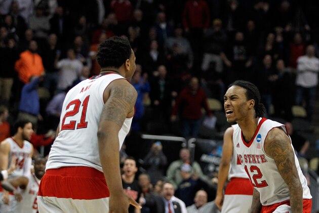 PITTSBURGH, PA - MARCH 19:  Beejay Anya #21 of the North Carolina State Wolfpack celebrates with teammate Anthony Barber #12 after defeating the LSU Tigers 66 to 65 during the second round of the 2015 NCAA Men's Basketball Tournament at Consol Energy Center on March 19, 2015 in Pittsburgh, Pennsylvania.  (Photo by Justin K. Aller/Getty Images)