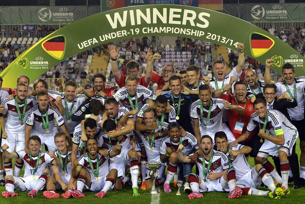 Germany team members celebrate with the trophy after defeating Portugal 1-0 in the U19 European Championship final in Szusza Ferenc Stadium in Budapest, Hungary, Thursday July 31, 2014. (AP Photo/MTI, Tibor Illyes)