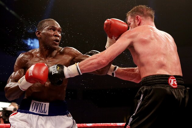 CARDIFF, WALES - AUGUST 17:  Enzo Maccarinelli (R) in action with Ovill McKenzie during their Commonwealth Light-Heavyweight Championship bout at Motorpoint Arena on August 17, 2013 in Cardiff, Wales.  (Photo by Scott Heavey/Getty Images)