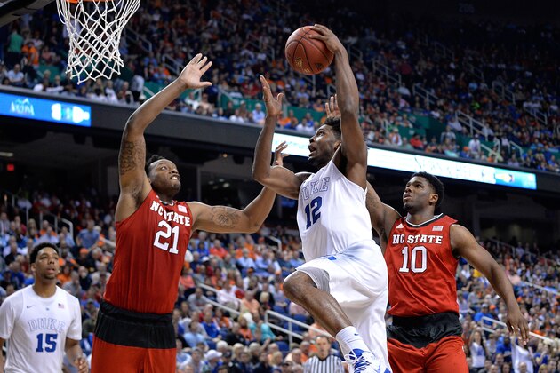 GREENSBORO, NC - MARCH 12:  Justise Winslow #12 of the Duke Blue Devils drives between Beejay Anya #21 and Lennard Freeman #10 of the North Carolina State Wolfpack during the quarterfinals of the ACC Basketball Tournament at Greensboro Coliseum on March 12, 2015 in Greensboro, North Carolina.  (Photo by Grant Halverson/Getty Images)