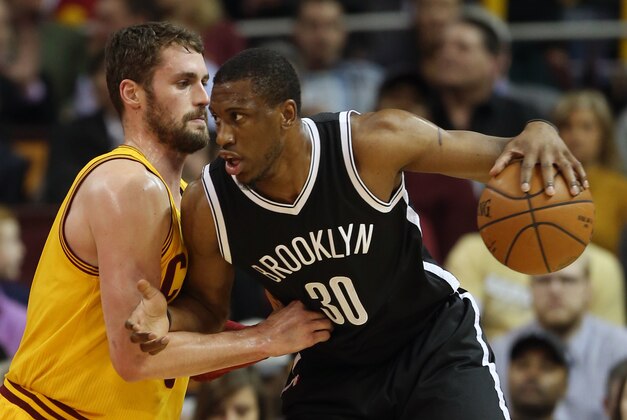 Mar 18, 2015; Cleveland, OH, USA; Brooklyn Nets forward Thaddeus Young (30) works for position against Cleveland Cavaliers forward Kevin Love (0) during the first quarter at Quicken Loans Arena. Mandatory Credit: Ron Schwane-USA TODAY Sports