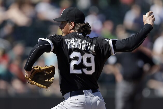 Chicago White Sox Jeff Samardzija works against the Oakland Athletics in the first inning of a spring training baseball game Sunday, March 8, 2015, in Mesa, Ariz. (AP Photo/Ben Margot)