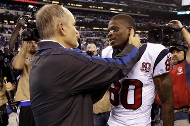 Indianapolis Colts head coach Chuck Pagano, left, talks to Houston Texans' Andre Johnson following an NFL football game, Sunday, Dec. 30, 2012, in Indianapolis. The Colts won the game 28-16. (AP Photo/Michael Conroy)