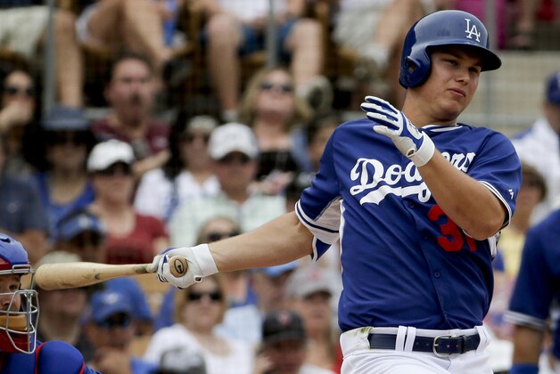 Los Angeles Dodgers' Joc Pederson bats against the Chicago Cubs during a spring training baseball exhibition game in Glendale, Ariz., on Wednesday, March 18, 2015. (AP Photo/Chris Carlson)
