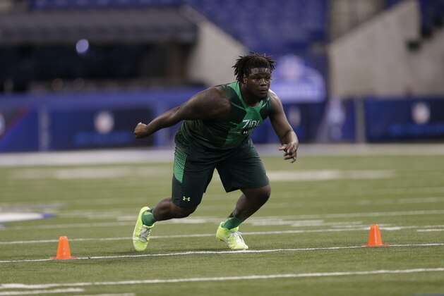 Texas defensive lineman Malcom Brown runs a drill at the NFL football scouting combine in Indianapolis, Sunday, Feb. 22, 2015. (AP Photo/David J. Phillip)