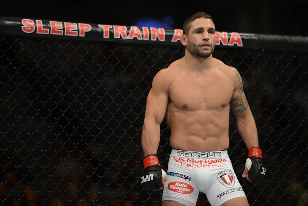 December 14, 2013; Sacramento, CA, USA; Chad Mendes (red gloves) fights Nik Lentz (blue gloves) during the featherweight bout of the UFC on FOX 9 at Sleep Train Arena. Mendes defeated Lentz. Mandatory Credit: Kyle Terada-USA TODAY Sports