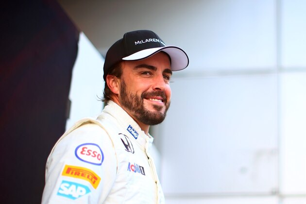 KUALA LUMPUR, MALAYSIA - MARCH 26:  Fernando Alonso of Spain and McLaren Honda poses for photographers outside the team garage during previews to the Malaysia Formula One Grand Prix at Sepang Circuit on March 26, 2015 in Kuala Lumpur, Malaysia.  (Photo by Mark Thompson/Getty Images)