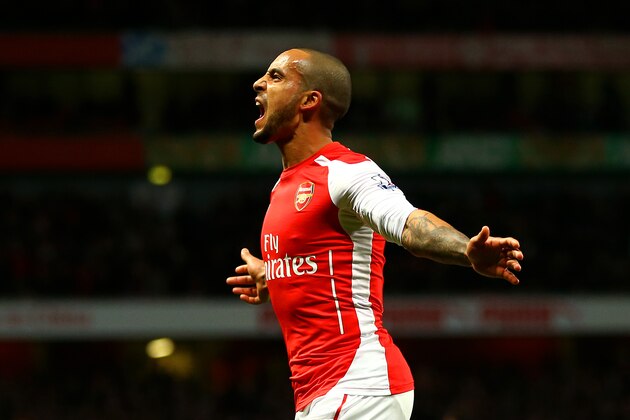 LONDON, ENGLAND - FEBRUARY 10: Theo Walcott of Arsenal celebrates after scoring his team's second goal during the Barclays Premier League match between Arsenal and Leicester City at Emirates Stadium on February 10, 2015 in London, England. (Photo by Richard Heathcote/Getty Images) LONDON, ENGLAND - FEBRUARY 10: Theo Walcott of Arsenal celebrates after scoring his team's second goal during the Barclays Premier League match between Arsenal and Leicester City at Emirates Stadium on February 10, 2015 in London, England. (Photo by Richard Heathcote/Getty Images)