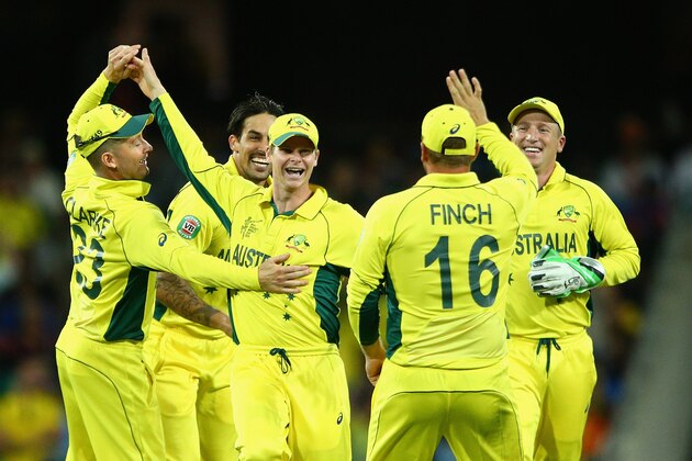 SYDNEY, AUSTRALIA - MARCH 26:  Steve Smith of Australia celebrates with team mates after running out Ravindra Jadeja of India during the 2015 Cricket World Cup Semi Final match between Australia and India at Sydney Cricket Ground on March 26, 2015 in Sydney, Australia.  (Photo by Cameron Spencer/Getty Images)