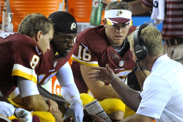 Washington Redskins offensive coordinator Sean McVay, right, talks on the sidelines with his three quarterbacks, Kirk Cousin (8), Robert Griffin III and Colt McCoy (16) during the second half of an NFL preseason football game against the Cleveland Browns, Monday, Aug. 18, 2014, in Landover, Md.  Washington defeated Cleveland 24-23. (AP Photo/Richard Lipski)