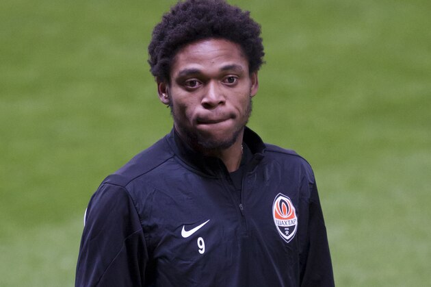 Donetsk's Luiz Adriano takes to the pitch during a training session at Old Trafford Stadium, Manchester, England, Monday, Dec. 9, 2013. Shakhtar Donetsk will play Manchester United in a Champion's League Group A soccer match on Tuesday. (AP Photo/Jon Super)