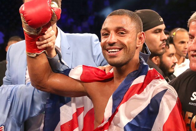 LOS ANGELES, CA - AUGUST 16:  Kell Brook poses with his belt and flag after getting the decision over Shawn Porter in their IBF Welterweight World Championship fight at StubHub Center on August 16, 2014 in Los Angeles, California.  (Photo by Stephen Dunn/Getty Images)