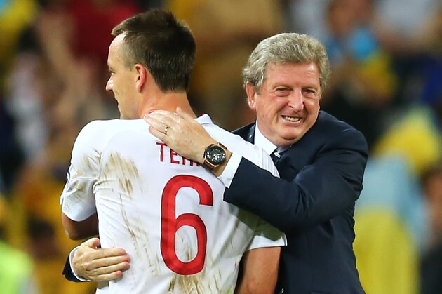 DONETSK, UKRAINE - JUNE 19:  Manager Roy Hodgson of England shakes hands with John Terry as they celebrate victory and progress to the quarter-finals during the UEFA EURO 2012 group D match between England and Ukraine at Donbass Arena on June 19, 2012 in Donetsk, Ukraine.  (Photo by Martin Rose/Getty Images)