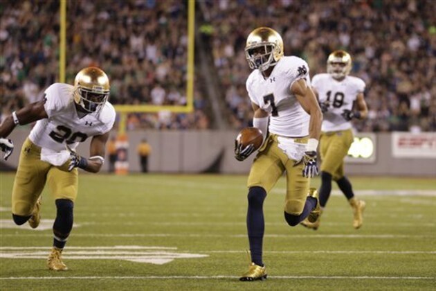 Notre Dame wide receiver William Fuller (7) scores a touchdown against Syracuse during the first half of an NCAA college football game, Saturday, Sept. 27, 2014, in East Rutherford, N.J. (AP Photo/Julio Cortez)