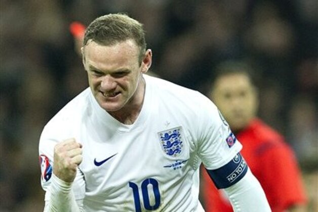 England's Wayne Rooney celebrates after scoring against Slovenia, during their Euro 2016 Group E qualifying soccer match at Wembley Stadium, London, Saturday, Nov. 15, 2014 (AP Photo/Bogdan Maran)