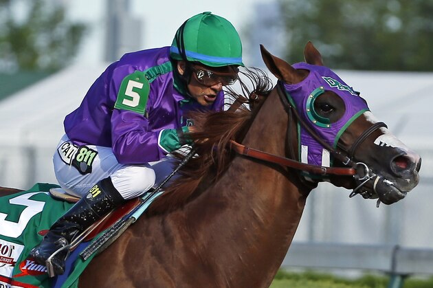 FILE - In this May 3, 2014, file photo, jockey Victor Espinoza rides California Chrome to win the 140th running of the Kentucky Derby horse race at Churchill Downs in Louisville, Ky. The California colt will be running in the Preakness with a bulls-eye on his back as perhaps racing's next superstar. He figures to face eight or nine rivals in the middle leg of the Triple Crown series, and one of them might be a filly.  (AP Photo/Matt Slocum, File)