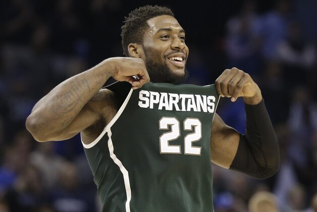 Michigan State's Branden Dawson (22) celebrates after an NCAA tournament college basketball game against Virginia in the Round of 32 in Charlotte, N.C., Sunday, March 22, 2015. Michigan State won 60-54. (AP Photo/Nell Redmond)