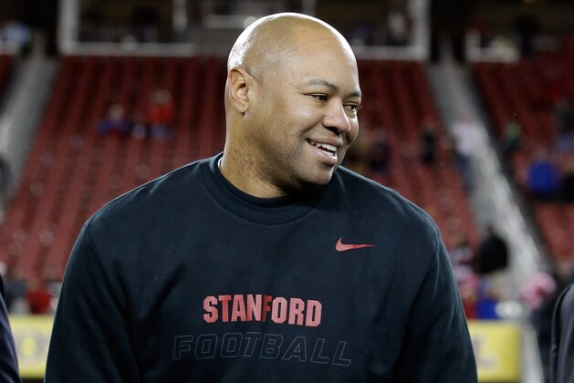SANTA CLARA, CA - DECEMBER 30:  Head coach David Shaw of the Stanford Cardinal is awarded the trophy after the Cardinal defeated the Maryland Terrapins in the Foster Farms Bowl at Levi's Stadium on December 30, 2014 in Santa Clara, California.  (Photo by Ezra Shaw/Getty Images)