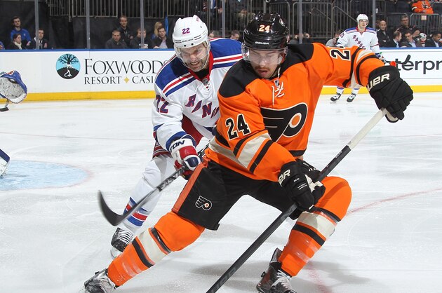 NEW YORK, NY - NOVEMBER 19:  Matt Read #24 of the Philadelphia Flyers skates with the puck against Dan Boyle #22 of the New York Rangers at Madison Square Garden on November 19, 2014 in New York City. (Photo by Jared Silber/NHLI via Getty Images)