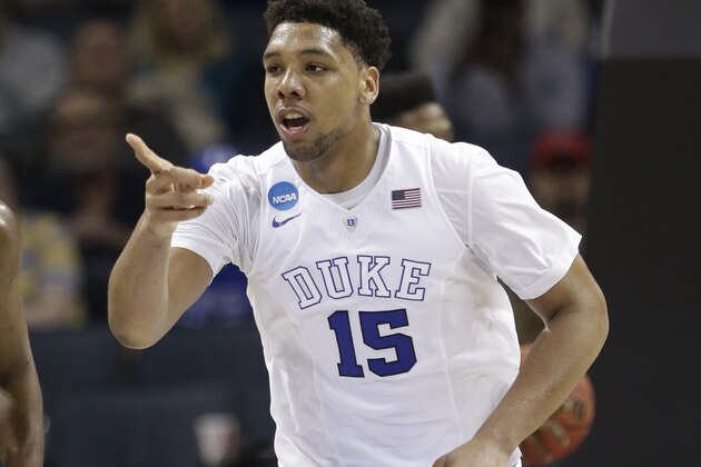 Duke's Jahlil Okafor (15) points to a teammate after a basket against San Diego State during the second half of an NCAA tournament college basketball game in the Round of 32 in Charlotte, N.C., Sunday, March 22, 2015. Duke won 68-49. (AP Photo/Gerald Herbert)