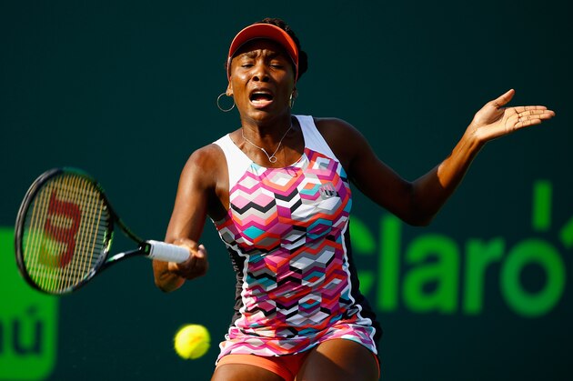 KEY BISCAYNE, FL - MARCH 26:  Venus Williams returns the ball to Urszula Radwanska of Poland during day 4 of the Miami Open at Crandon Park Tennis Center on March 26, 2015 in Key Biscayne, Florida.  (Photo by Al Bello/Getty Images)