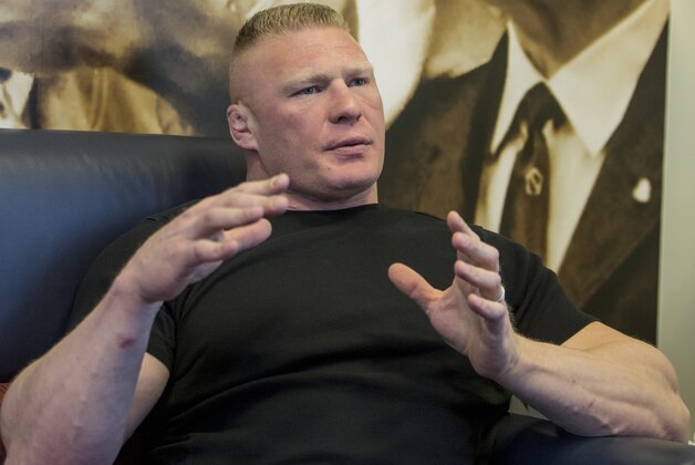 Former UFC heavyweight champion Brock Lesnar pauses for a photo after ruling out a return to mixed martial arts, ending three years of speculation about the biggest pay-per-view star in the sport's history, as he announced he had re-signed with WWE in an interview on ESPN's