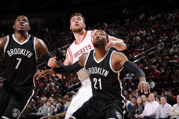 HOUSTON, TX - FEBRUARY 27:  Cory Jefferson #21 of the Brooklyn Nets boxes out against Donatas Motiejunas #20 of the Houston Rockets during the game on February 27, 2015 at the Toyota Center in Houston, Texas. NOTE TO USER: User expressly acknowledges and agrees that, by downloading and or using this photograph, User is consenting to the terms and conditions of the Getty Images License Agreement. Mandatory Copyright Notice: Copyright 2015 NBAE (Photo by Bill Baptist/NBAE via Getty Images)