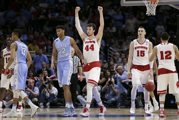 Wisconsin forward Frank Kaminsky (44) reacts next to North Carolina forward Isaiah Hicks (22) after Wisconsin beat North Carolina 79-72 in a college basketball regional semifinal in the NCAA Tournament, Thursday, March 26, 2015, in Los Angeles. (AP Photo/Jae C. Hong)